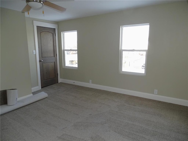 carpeted empty room with ceiling fan