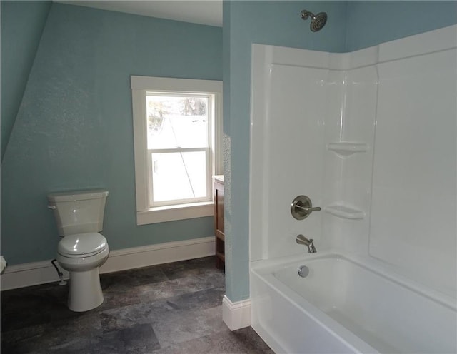 bathroom featuring toilet and tub / shower combination