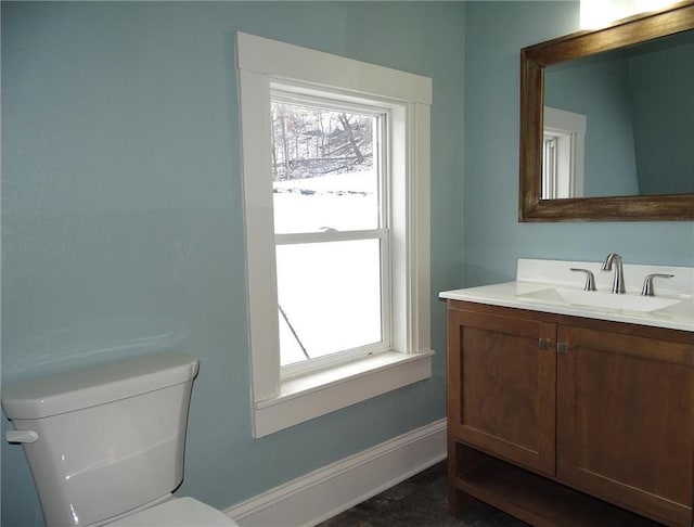 bathroom featuring toilet and vanity