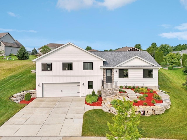 view of front facade featuring a front yard and a garage