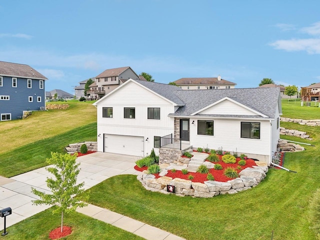 view of front of property with a front lawn and a garage