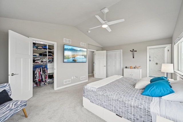 carpeted bedroom with vaulted ceiling and ceiling fan