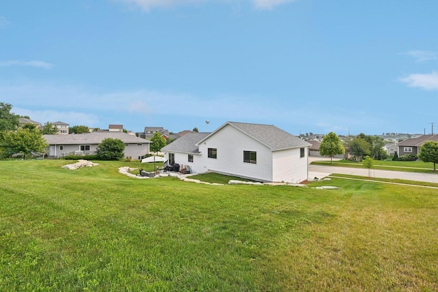 view of side of property with a lawn