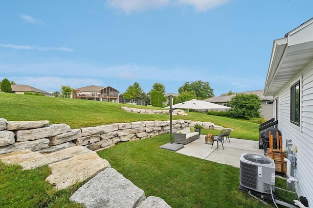 view of yard featuring central AC and a patio area