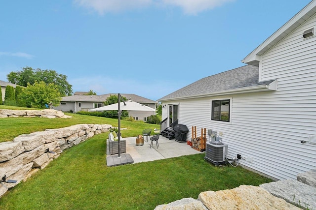 view of yard featuring a patio area and central AC