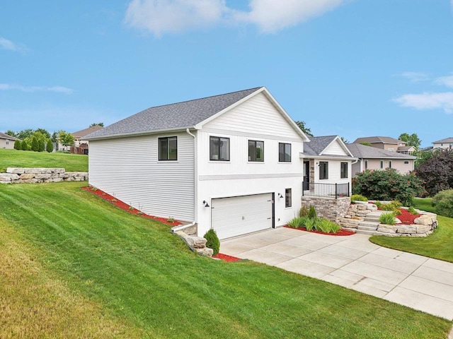 view of front of home featuring a garage and a front yard