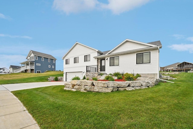 view of front of house with a garage and a front yard