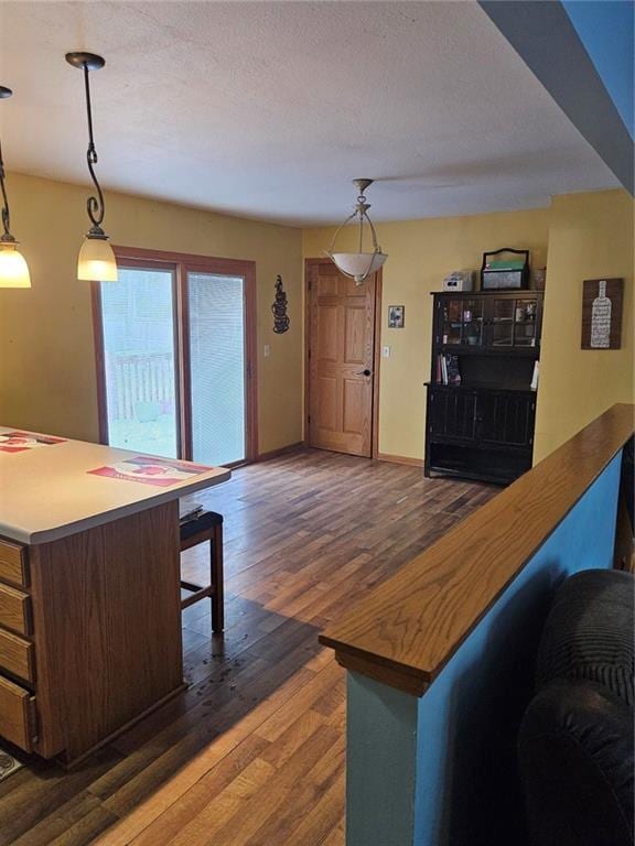 living room with dark wood-type flooring and a textured ceiling