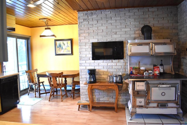 living room featuring light wood-type flooring, a baseboard heating unit, and wooden ceiling