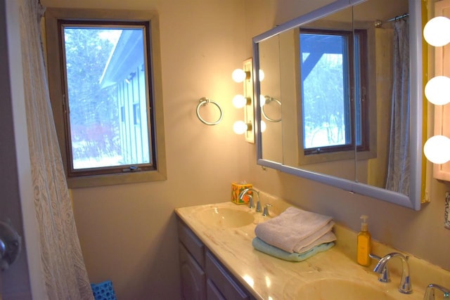 bathroom with a healthy amount of sunlight and vanity