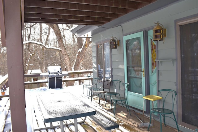 view of snow covered deck