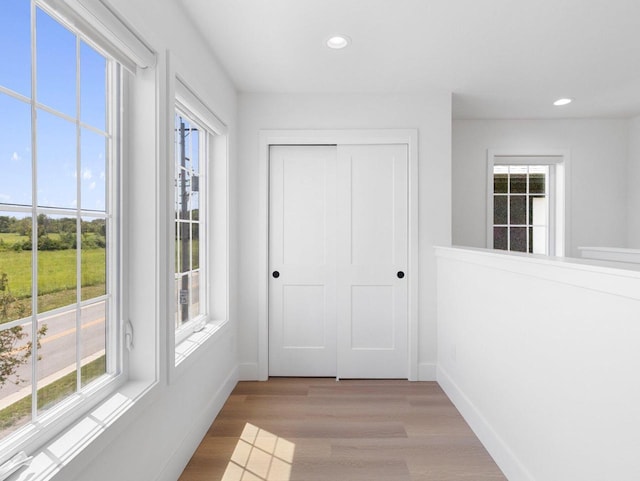 doorway with light hardwood / wood-style floors