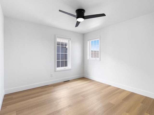 unfurnished room with ceiling fan and light hardwood / wood-style floors