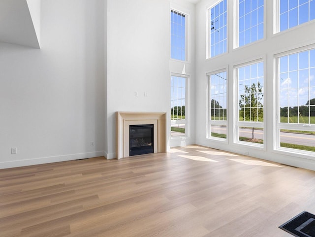 unfurnished living room featuring light wood-type flooring