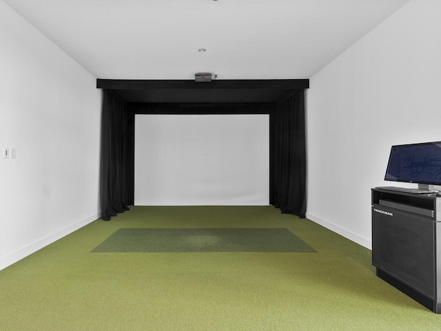 playroom featuring golf simulator and carpet flooring