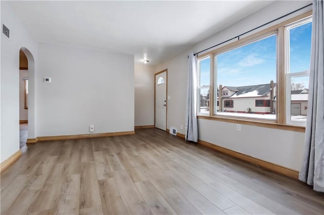 unfurnished room with light hardwood / wood-style flooring