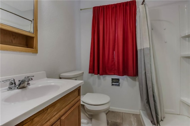 bathroom with toilet, vanity, and a shower with curtain