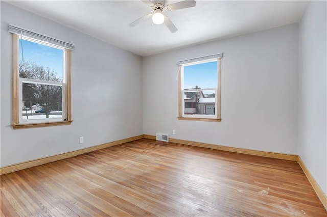 unfurnished room featuring ceiling fan and light wood-type flooring