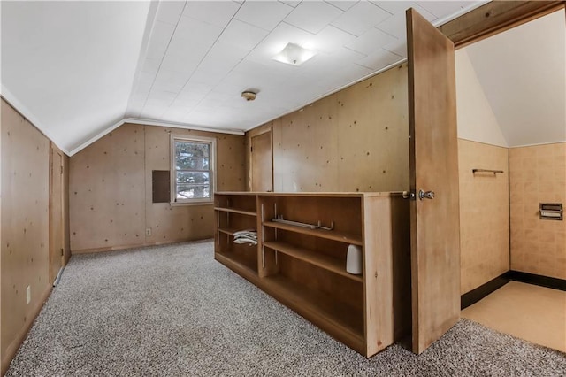 bonus room with light colored carpet and lofted ceiling