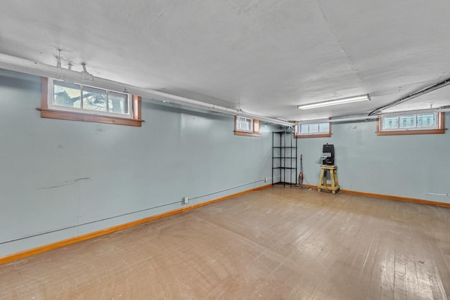 basement featuring hardwood / wood-style floors