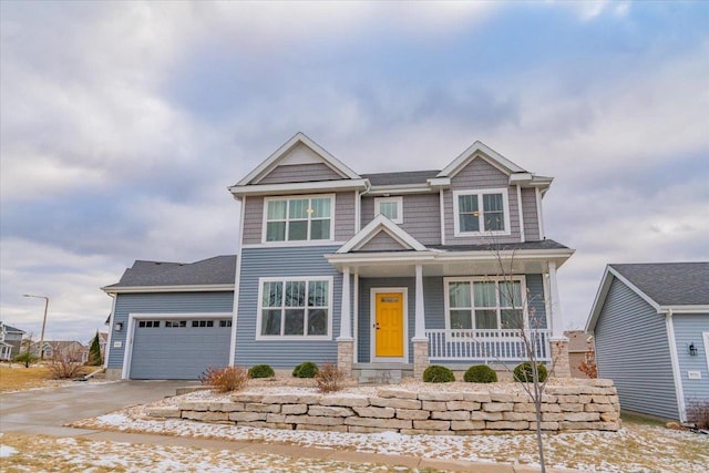 craftsman-style house with covered porch and a garage