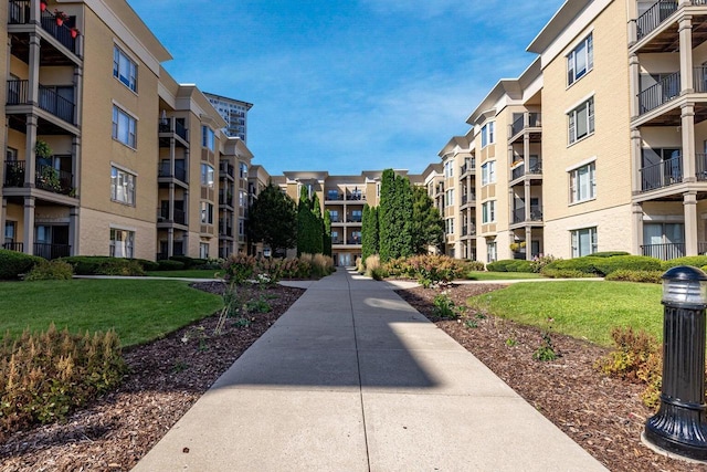 view of property's community featuring a lawn