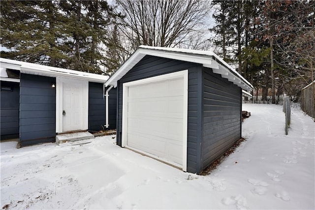 view of snow covered garage