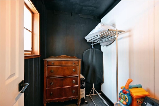 spacious closet featuring dark colored carpet