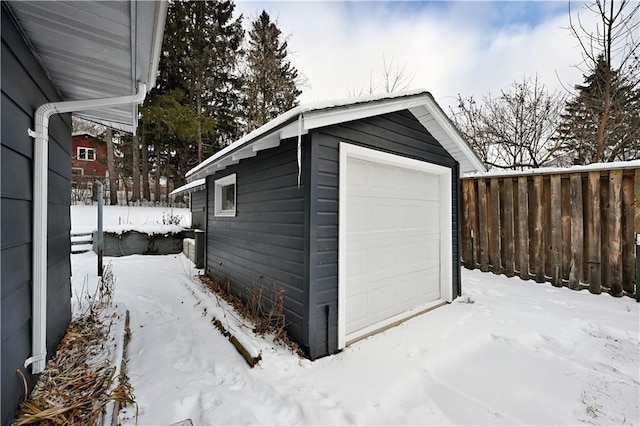 view of snow covered garage