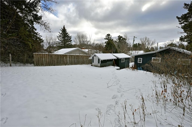 view of yard layered in snow