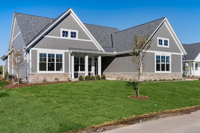 craftsman-style house with a front yard