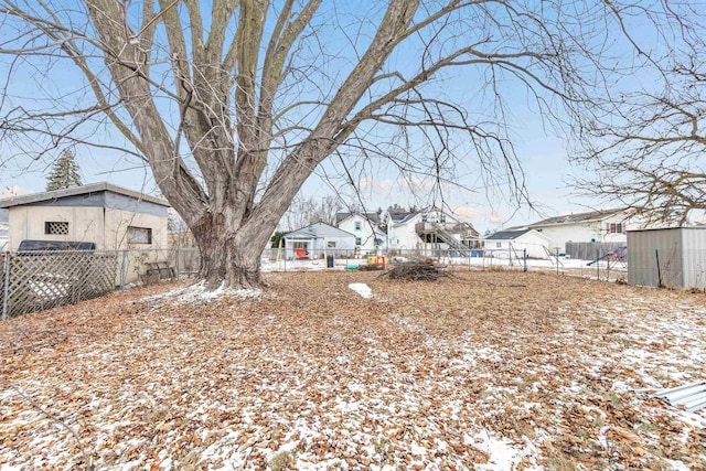 view of yard layered in snow