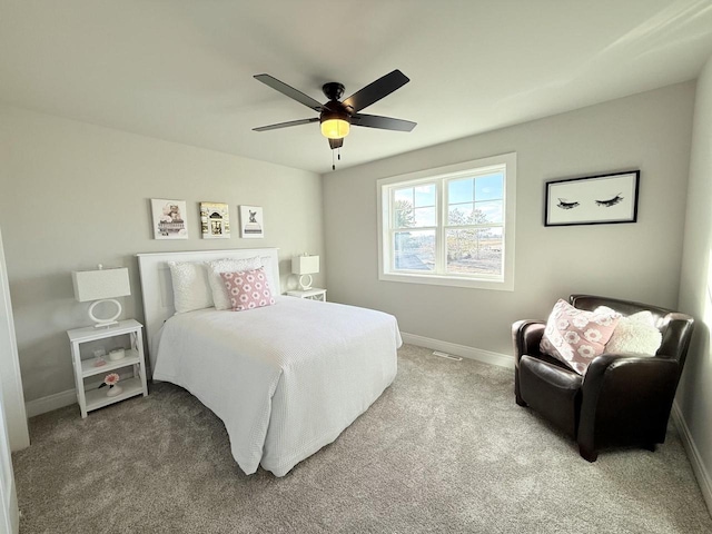 bedroom featuring ceiling fan and carpet