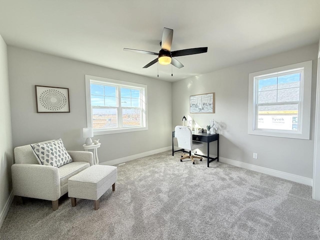 office with ceiling fan and light colored carpet