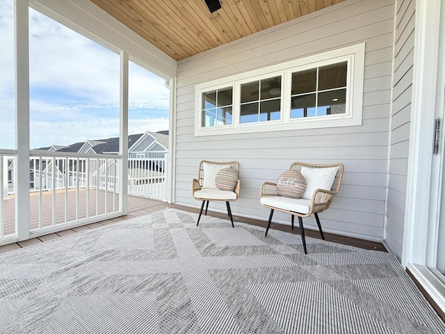 sunroom / solarium featuring wood ceiling