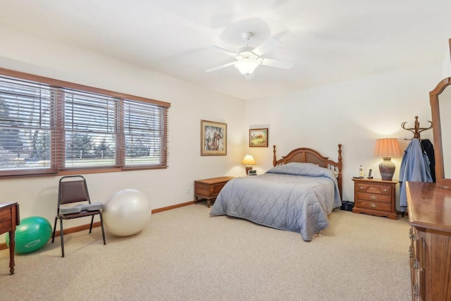 bedroom featuring ceiling fan and light colored carpet