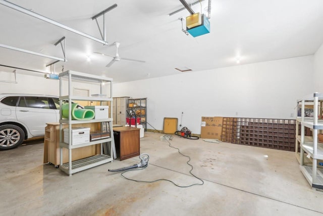 garage with ceiling fan and a garage door opener