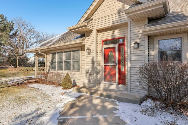 view of snow covered property entrance