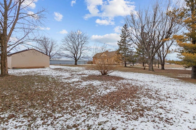 view of yard layered in snow