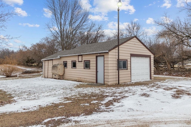 view of snow covered garage