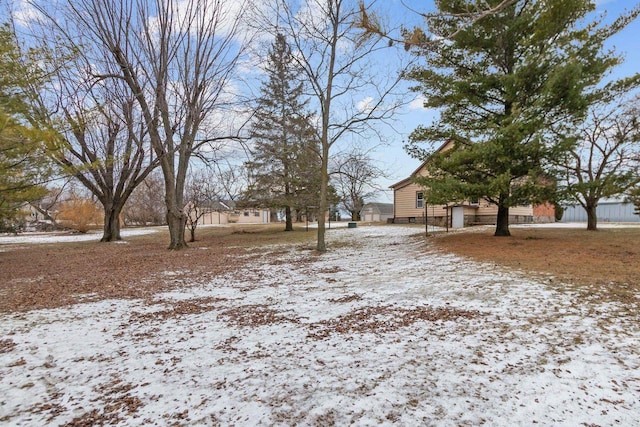 view of yard covered in snow