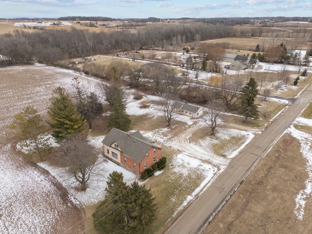 snowy aerial view featuring a rural view