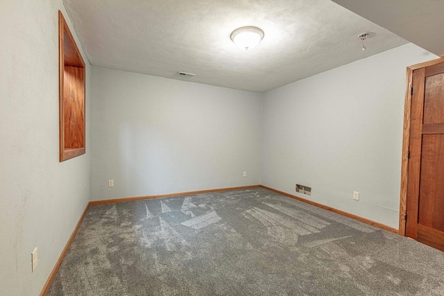 8325 S Avon Store Rd, Brodhead, WI 53520 - unfurnished room with visible vents, baseboards, carpet, and a textured ceiling