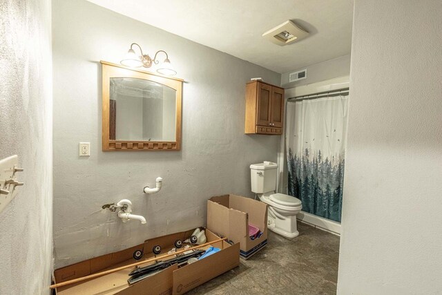 8325 S Avon Store Rd, Brodhead, WI 53520 - bathroom with visible vents, curtained shower, and toilet