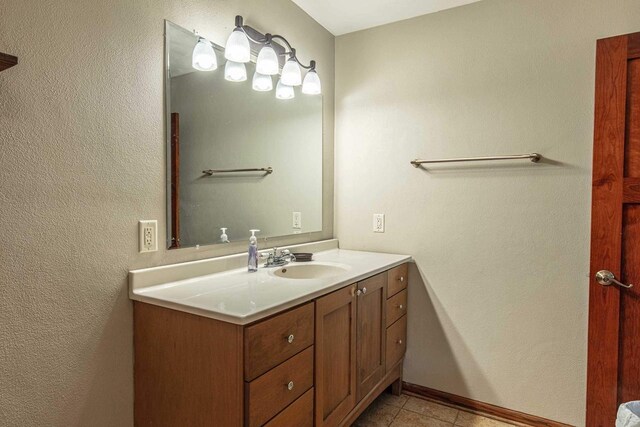 8325 S Avon Store Rd, Brodhead, WI 53520 - bathroom featuring vanity, baseboards, and tile patterned flooring