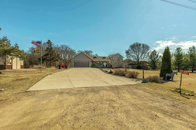 8325 S Avon Store Rd, Brodhead, WI 53520 - view of yard with an attached garage and concrete driveway