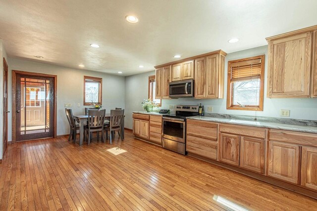 8325 S Avon Store Rd, Brodhead, WI 53520 - kitchen featuring light wood-style flooring, recessed lighting, and appliances with stainless steel finishes