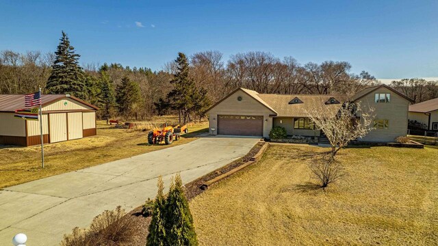 8325 S Avon Store Rd, Brodhead, WI 53520 - ranch-style home with driveway, a front yard, a storage shed, and a garage