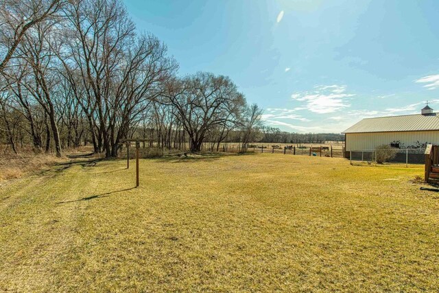 8325 S Avon Store Rd, Brodhead, WI 53520 - view of yard featuring an outbuilding and fence