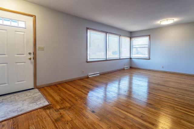 entryway with hardwood / wood-style flooring